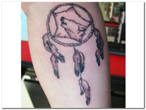 Wolves Head In Dreamcatcher Tattoo On Back Leg